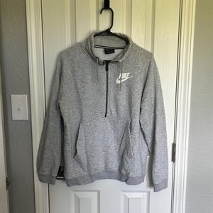 Women’s Nike grey size medium half-zip sweatshirt.